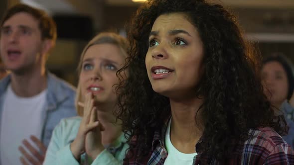 People Cheering for Favorite Sports Team Victory, Disappointed About Score alt