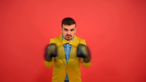 Man In Yellow Jacket And Gloves Couse To Fight