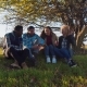 Four Multiracial Friends Sitting At Rural Area. - VideoHive Item for Sale