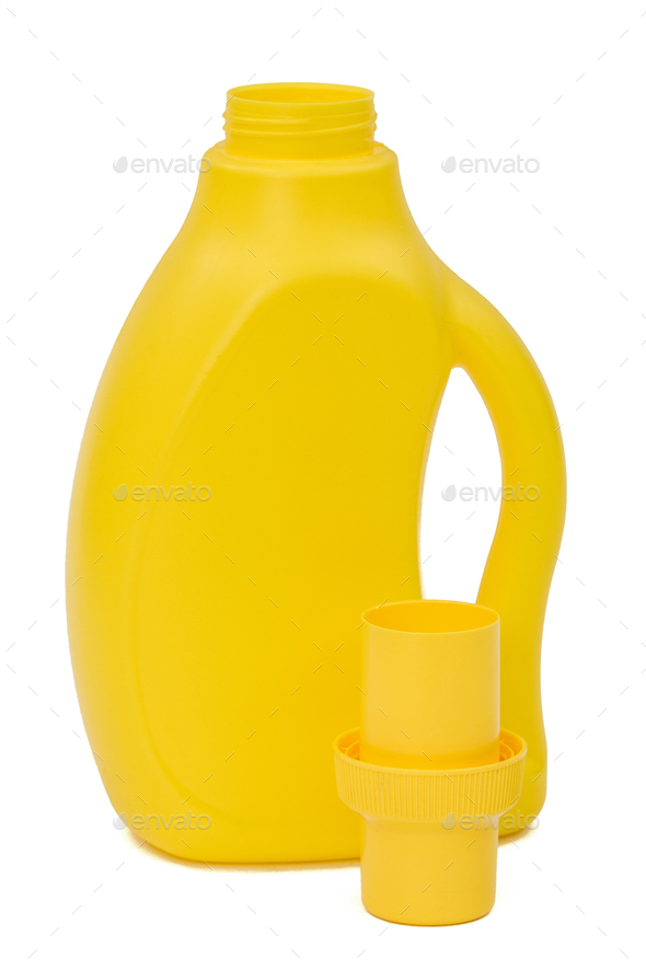 Yellow plastic bottle with a dispenser in cap, isolated on white