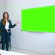 Young Female Teacher Standing near Green Screen Board Giving Lecture for Students - VideoHive Item for Sale