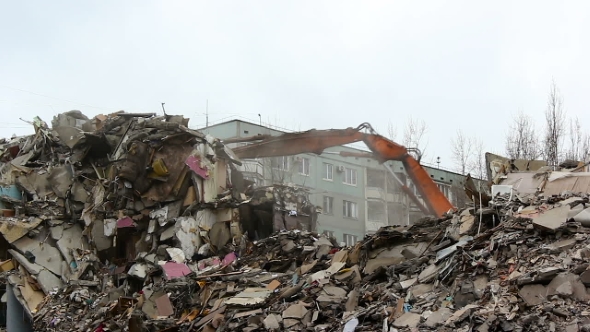 Demolition Of Building In Urban Environments With Heavy Machinery