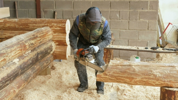 Man Makes Curly Cutting Wood Chainsaw. The Log Will Be Part Of The Future Of The Wooden House