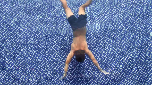 A Boy Swimming Underwater
