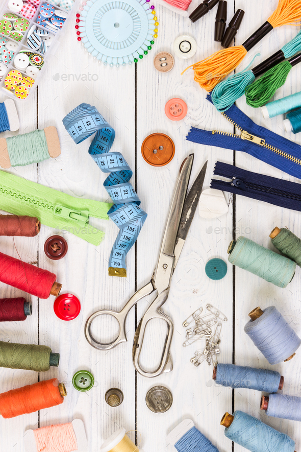 Old scissors, buttons, threads, measuring tape and sewing suppli Stock ...