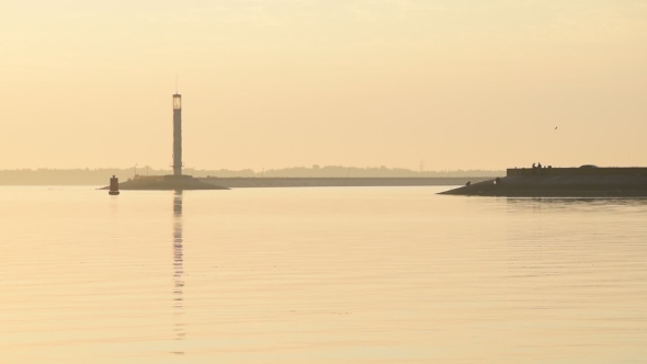 Scenic Calm Landscape With Lighthouse At Dawn