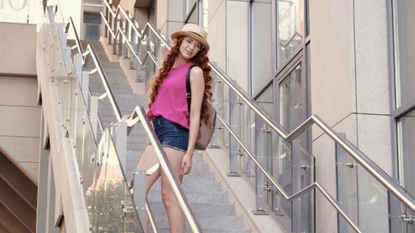 Beautiful Young Girl Posing On Steps In A City Background alt