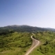 Road Through Green Forested Hills - VideoHive Item for Sale