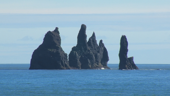 Reynisdrangar, Basalt Sea Stacks, In Southern Coast Of Iceland, In Sunny Day With Calm Blue Ocean