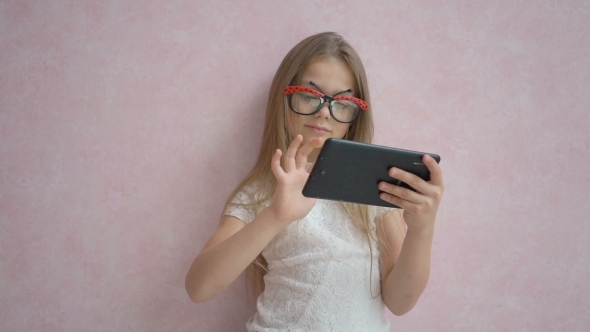 Cute Little Girl Using Tablet Computer