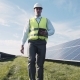 Man In Vest Walking Near Solar Panels - VideoHive Item for Sale