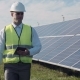Solar Panel Technician Using Tablet Near Array - VideoHive Item for Sale