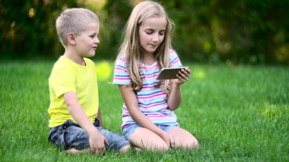 Children With Smart Phone Ooutside