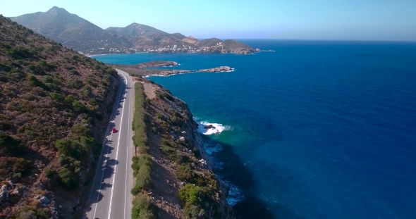 Flying Above Road By Seashore