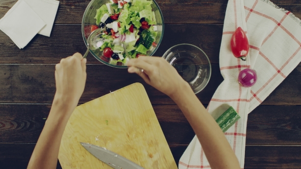 View Of Mixing The Products Of a Salad
