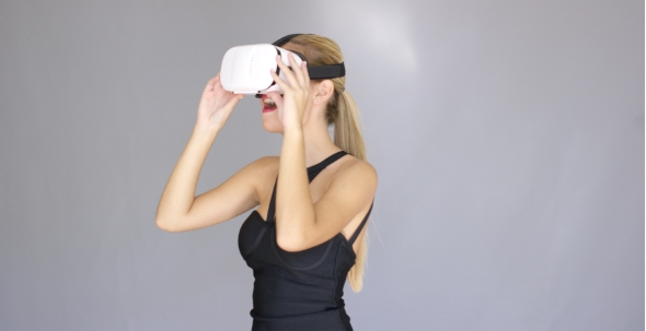 Beautiful Sexy Blond Girl Enjoys Virtual Reality Glasses alt