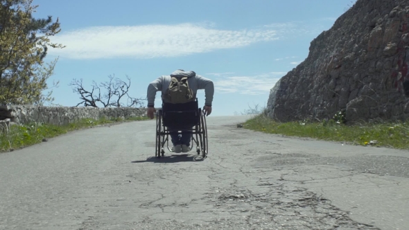 Traveler Disabled Man On Mountain Road