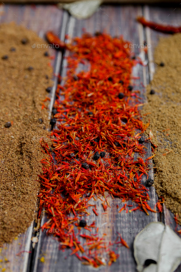 Colourful spices on the table. Various Spices in on wooden background. Spices background. saffron