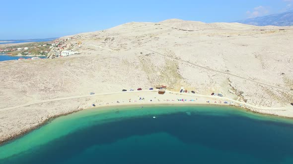 Flying above isolated beach of Pag island, Croatia alt