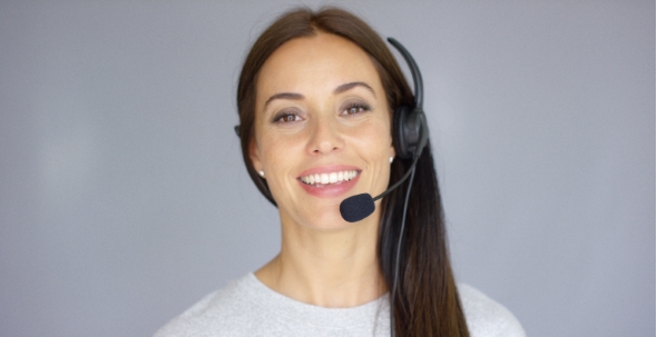 Adorable Call Center Agent Speaking With Someone On Headset alt