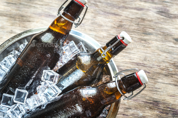 Bottles of beer in ice cubes