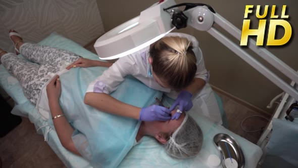 Beautician Makes Procedure Patient Draws Eyebrows