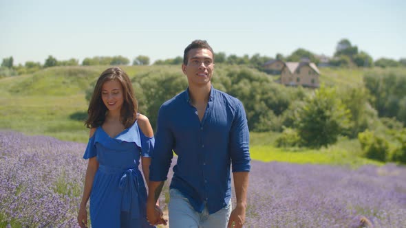 Mixed Race Couple Enjoying a Walk in Floral Glade alt