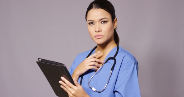 Frowning Nurse Or Doctor Checking Information alt