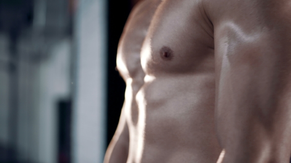 Man Flexing His Muscles. alt