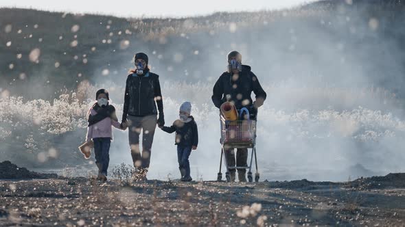 Survivor Family in Gas Mask Going Through Clouds of Toxic Smoke in Desolate Landscape.