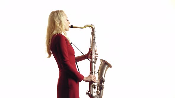 Woman Playing a Melody on Saxophone