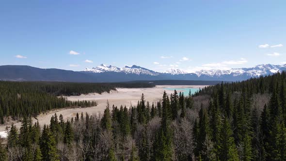 Abraham Lake In Spring With Snow Top Mountains alt