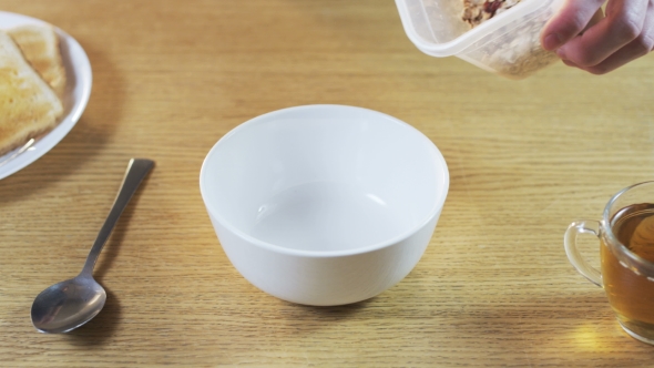 Putting Muesli Into a Bowl alt