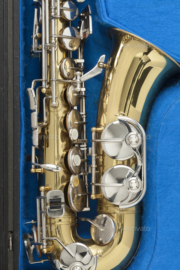 Shiny bronze saxophone in a blue case