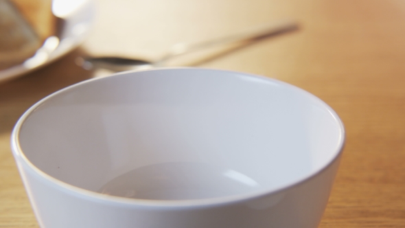 Putting Muesli Into a Bowl alt