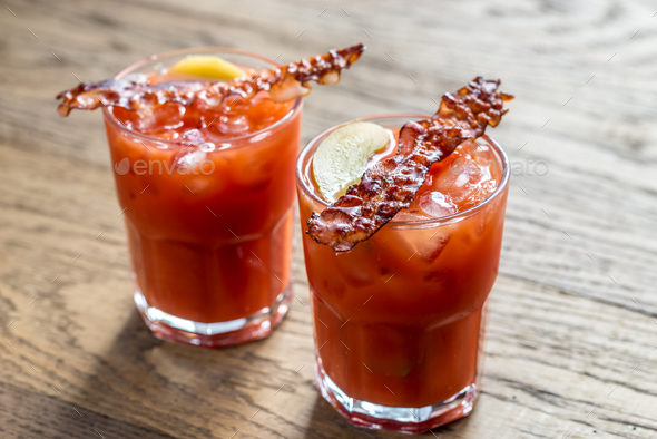 Two glasses of Bloody Mary with bacon rashers Stock Photo by Alex9500