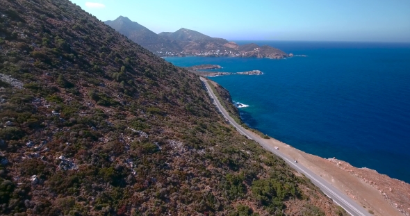 Flying Above Road By Seashore