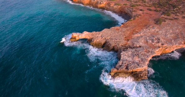 Beautiful Seashore With Clifs At Sunset