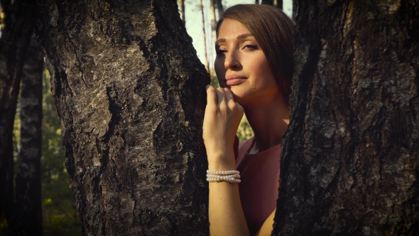 Young Girl Among Forest Trees