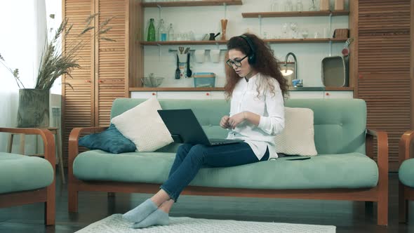 A Girl Chats Via Laptop, Staying Home During Quarantine. Online Education Concept alt