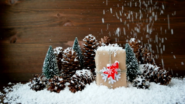 Christmas And New Year Background With Snow, Pine Cones, Present With Red Fir Tree. alt