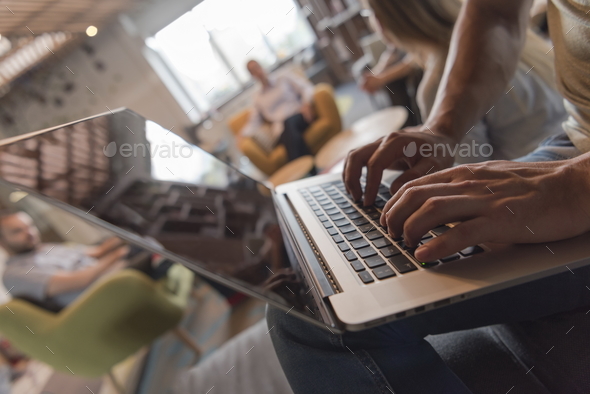 close up of male hands while working on laptop - Stock Photo - Images