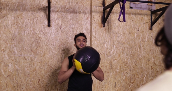 Two Man In Gym Sport Exercising Throw Ball Crossfit Training, Young Sportsman Working Out alt