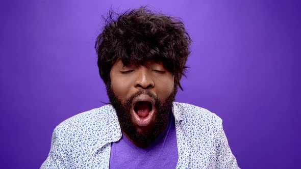 Shocked Amazed Young Bearded Black African American Man Purple Background alt
