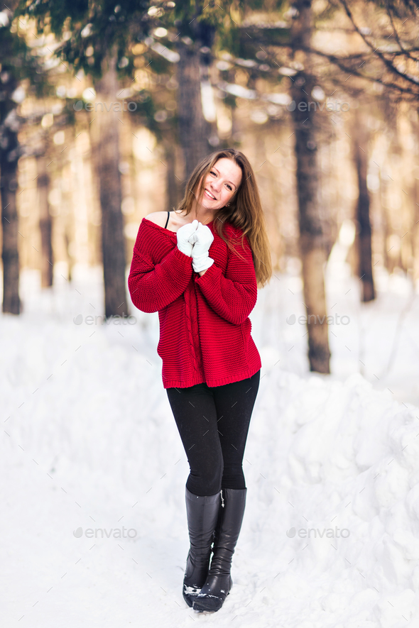 Winter portrait of young beautiful woman. Snow winter beauty cold