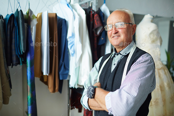 Confident tailor with crossed arms - Stock Photo - Images