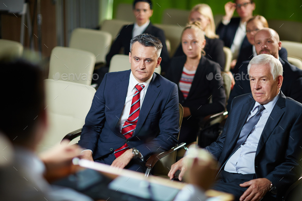Audience listening at conference - Stock Photo - Images