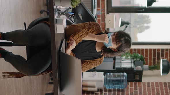 Business Woman Working with Laptop and Rate Charts alt