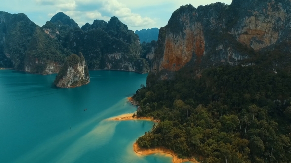 Aerial: Mountains And Jungles On The Lake With a Bird's Eye View.