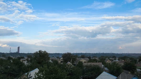 Clouds In The Sky Moving Over The Houses In The City alt